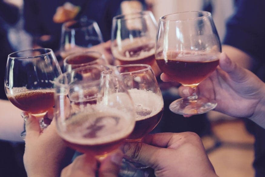 Friends raising a toast with cocktails